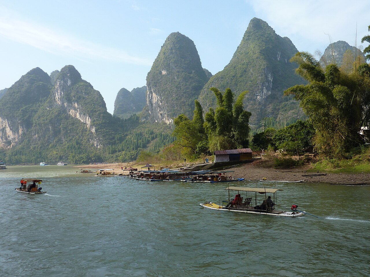 4-star luxury cruise ship sailing along karst mountain peaks on the Li River