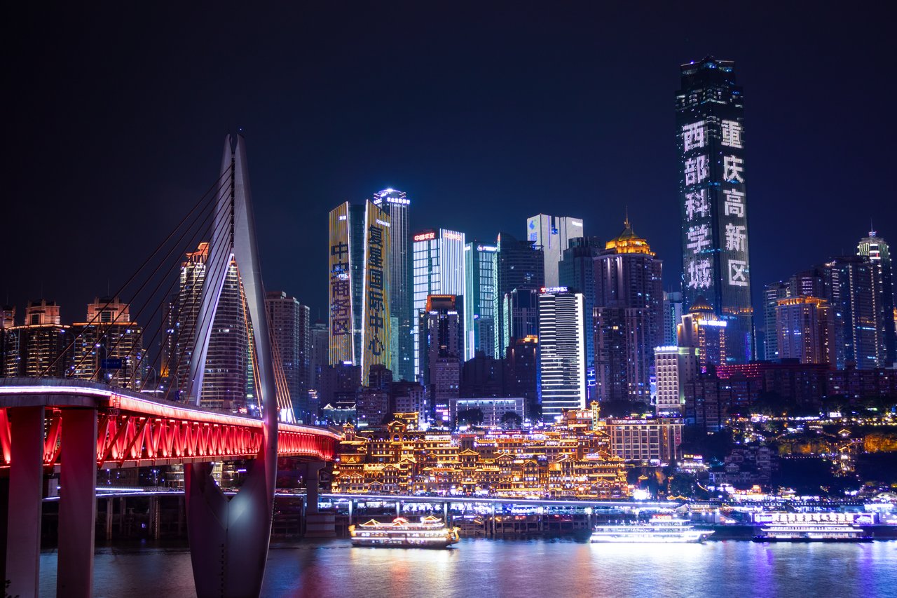 Chongqing bridges and neon river skyline across the Jialing River