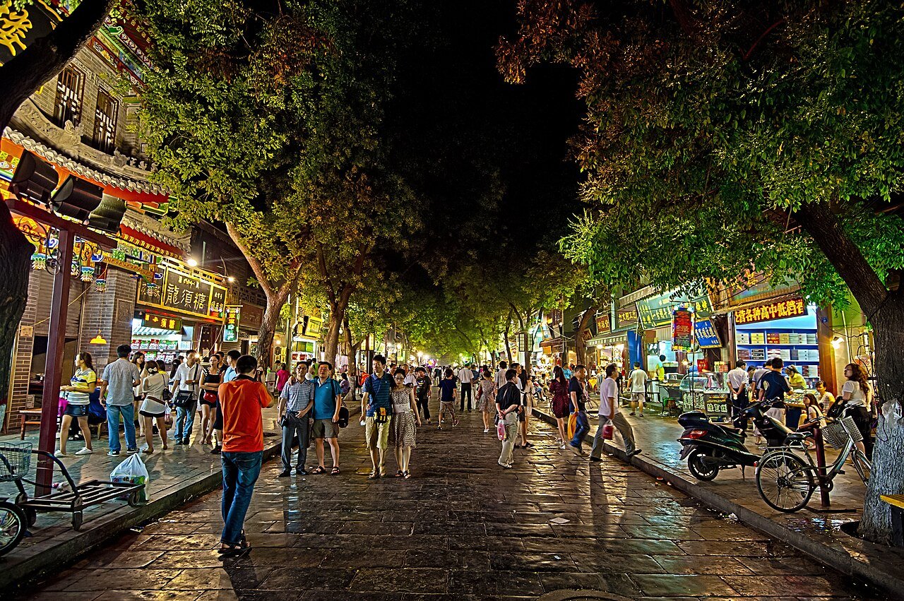 Vibrant Sajinqiao and Muslim Quarter food stalls with lamb skewers and steamed buns in Xi’an