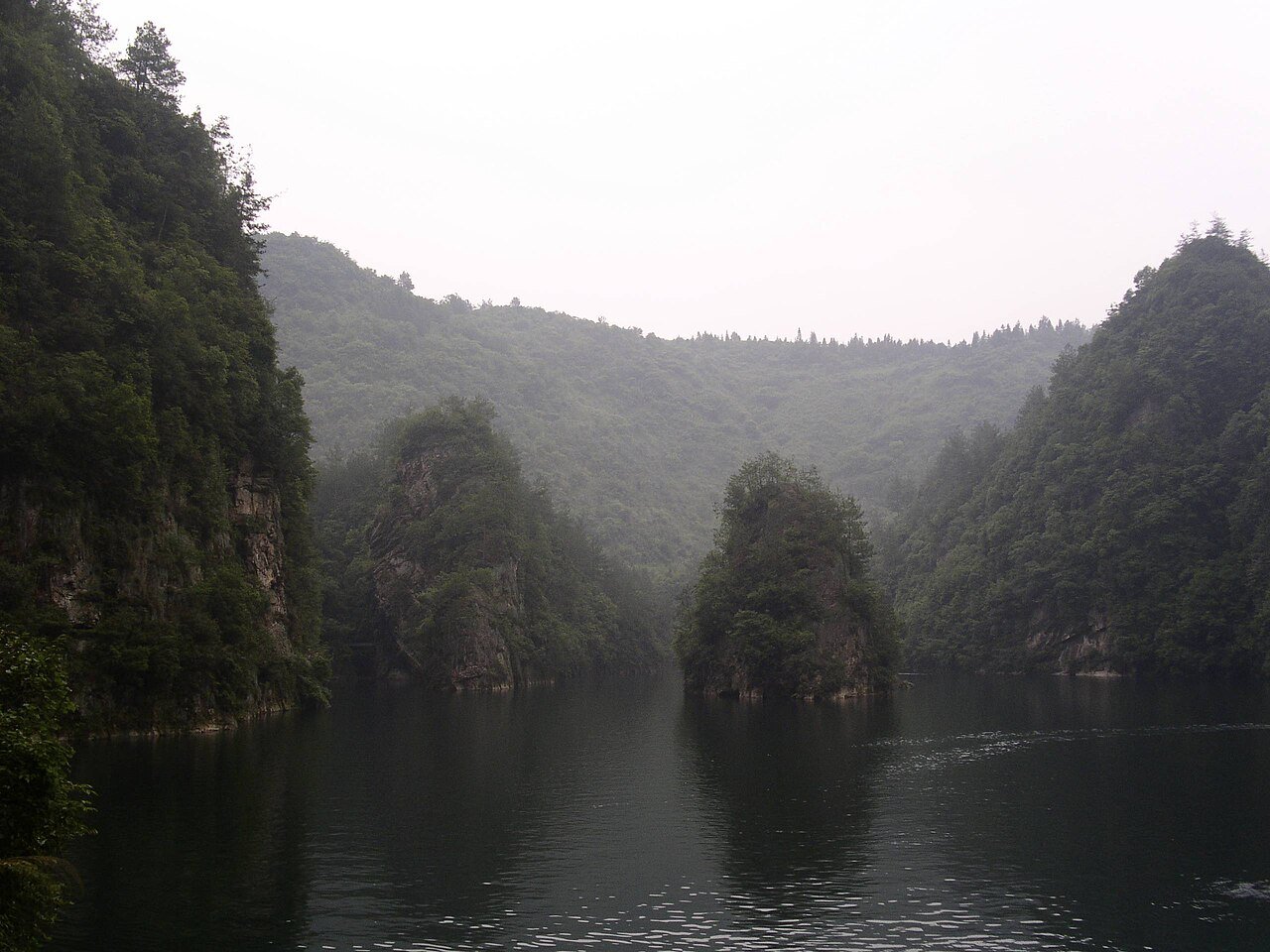Serene emerald waters and limestone karst cliffs of Baofeng Lake in Zhangjiajie